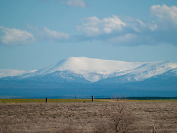 Scenic view of snowcapped mountains against sky