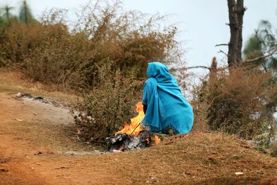 Woman standing on grassy field
