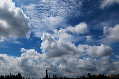 Low angle view of buildings against blue sky