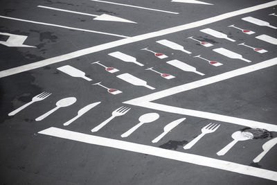 High angle view of arrow symbol on road