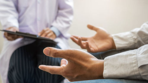 Close-up of man holding hands