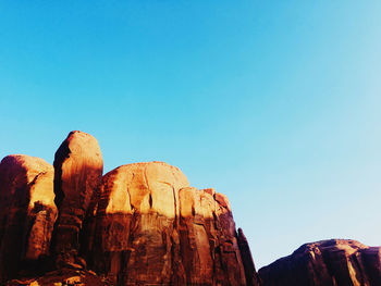 Rock formations against blue sky