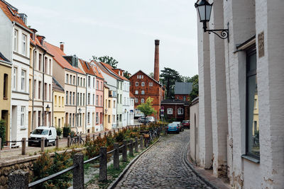 Street amidst buildings against sky