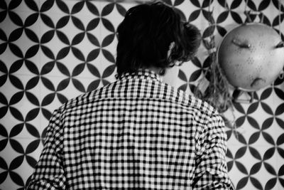 Close-up of woman standing on tiled floor