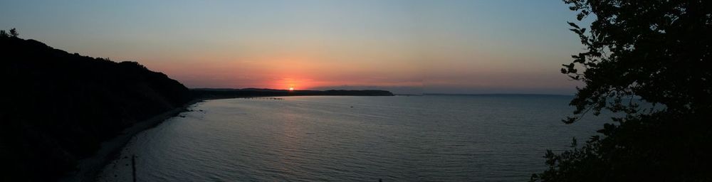 Scenic view of sea at sunset