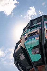 Low angle view of office building against sky