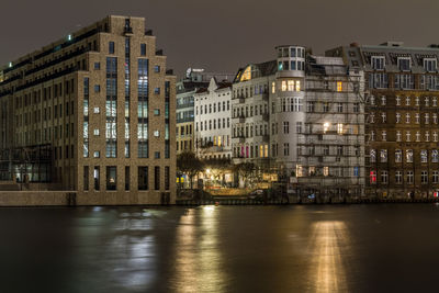 Illuminated buildings at waterfront