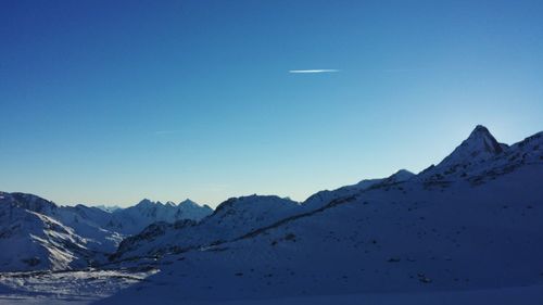 Scenic view of mountains against cloudy sky