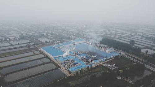 High angle view of buildings in city against sky