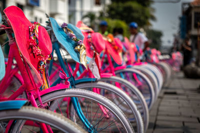 Close-up of multi colored bicycles on street