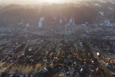 High angle view of crowd by buildings in city