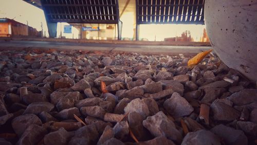 Rocks in farm against sky