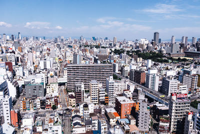 High angle view of modern buildings in city against sky