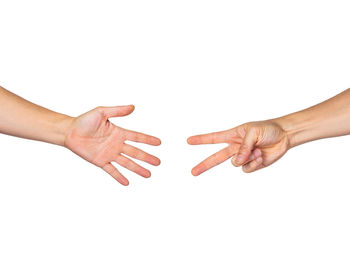 Close-up of hands over white background