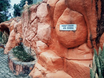 Close-up of text on rock