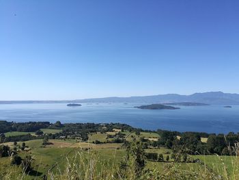 Scenic view of sea against clear blue sky