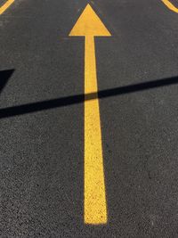 High angle view of yellow marking on road