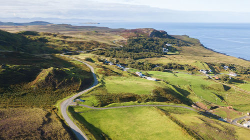 High angle view of road by sea against sky