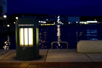 Close-up of illuminated cityscape against sky at night