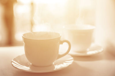 Close-up of coffee cup on table