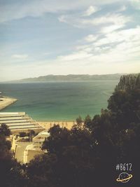 Scenic view of sea against cloudy sky