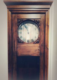 Close-up of clock on door