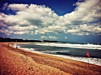 Scenic view of sea against cloudy sky