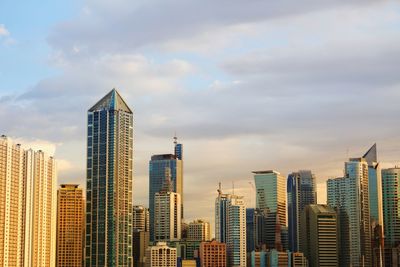 Skyscrapers in city against sky