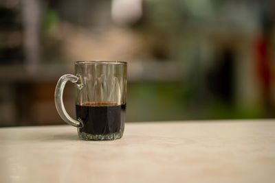 Close-up of coffee cup on table