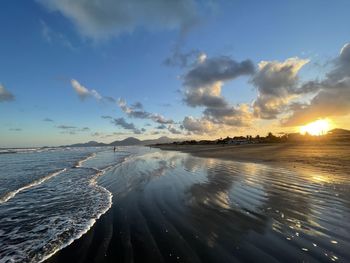 Panoramic view of sea against sky during sunset