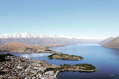 Scenic view of lake against clear blue sky