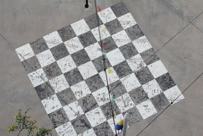 Low section of person standing on tiled floor