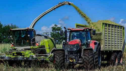 Tractor on field against sky