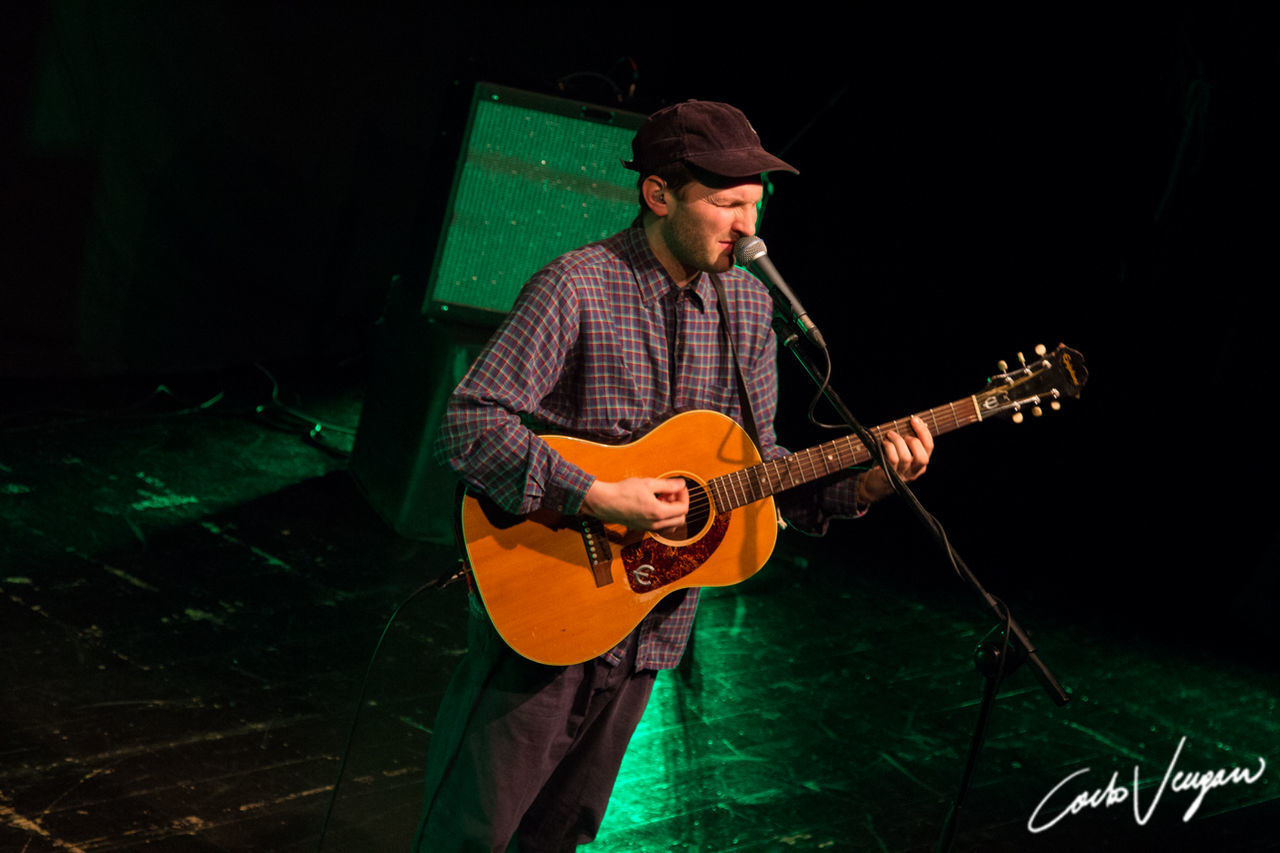 musical instrument, music, guitar, string instrument, playing, musical equipment, musician, performance, arts culture and entertainment, artist, guitarist, one person, skill, men, acoustic guitar, front view, night, indoors, holding, stage, plucking an instrument, nightlife, entertainment occupation, concert