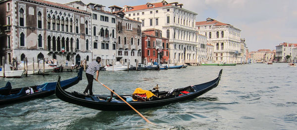 Boats moored in canal