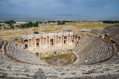 High angle view of old ruins against sky in city