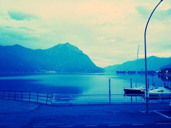 Scenic view of lake against cloudy sky