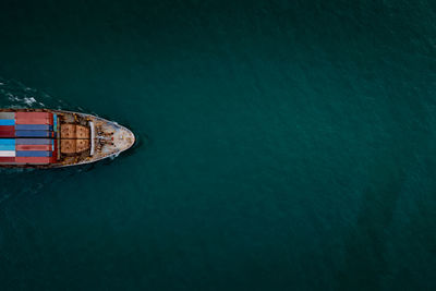 High angle view of ship sailing in sea