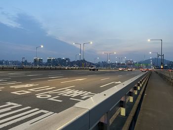 Vehicles on road against sky