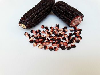 High angle view of candies against white background