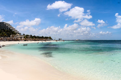 View of beach against cloudy sky