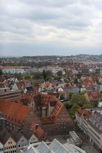 High angle view of houses in town against sky