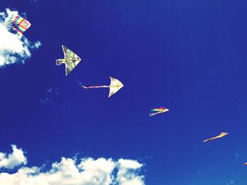 Low angle view of airplane flying in sky