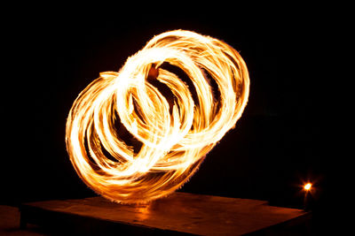 Light painting against dark sky at night