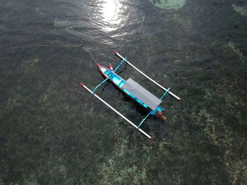 High angle view of outrigger in sea