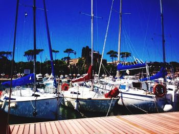 Boats moored at harbor