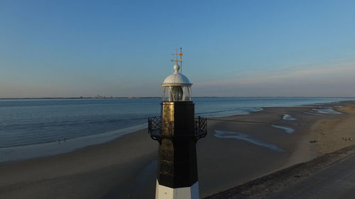 Scenic view of sea against clear sky at sunset