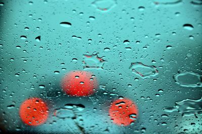 Full frame shot of raindrops on glass window