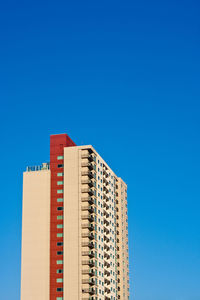 Low angle view of building against blue sky