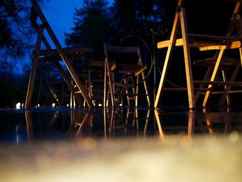 Illuminated bridge against sky at night